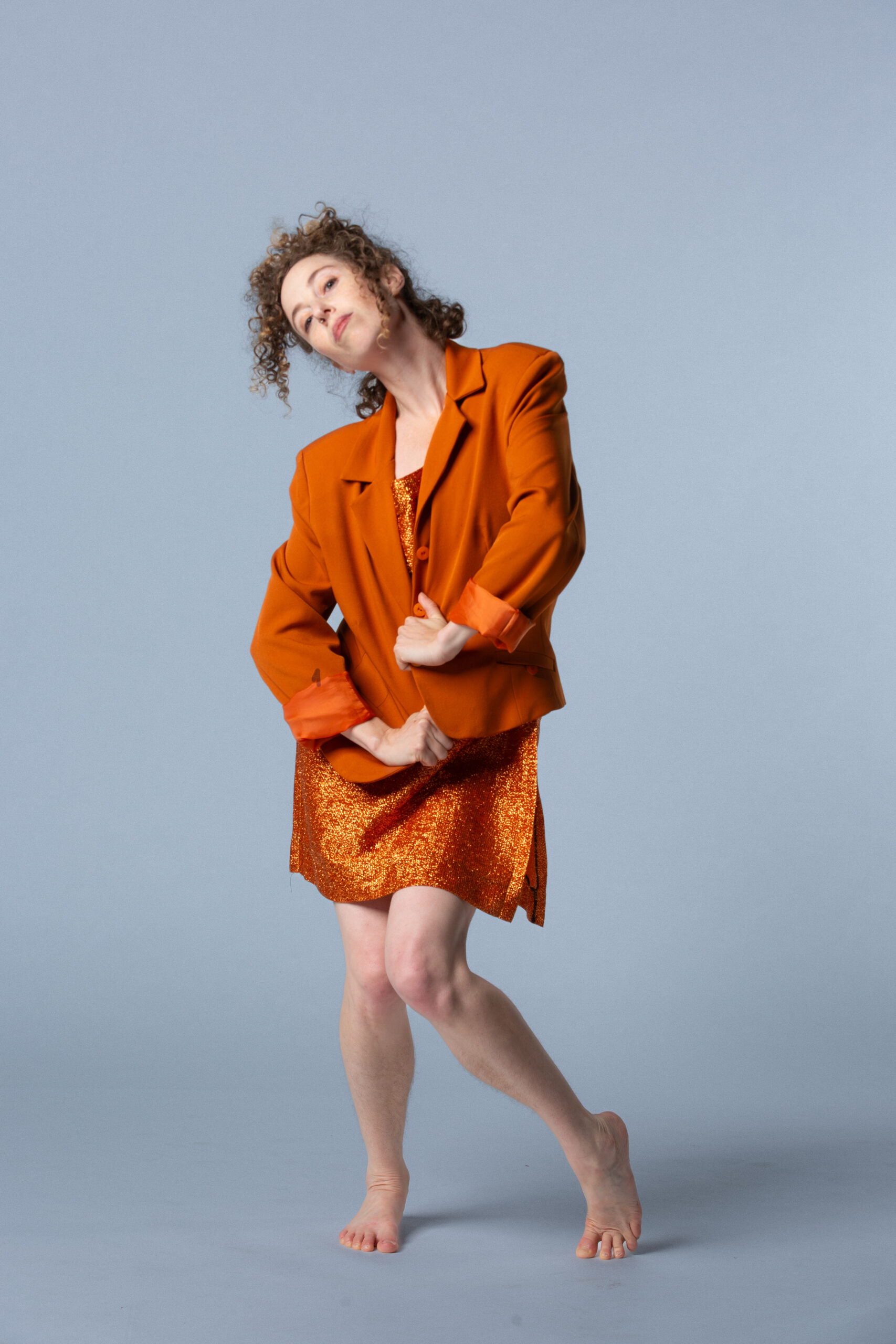 woman in orange standing